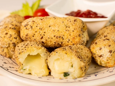 Bastones de calabaza y queso al horno